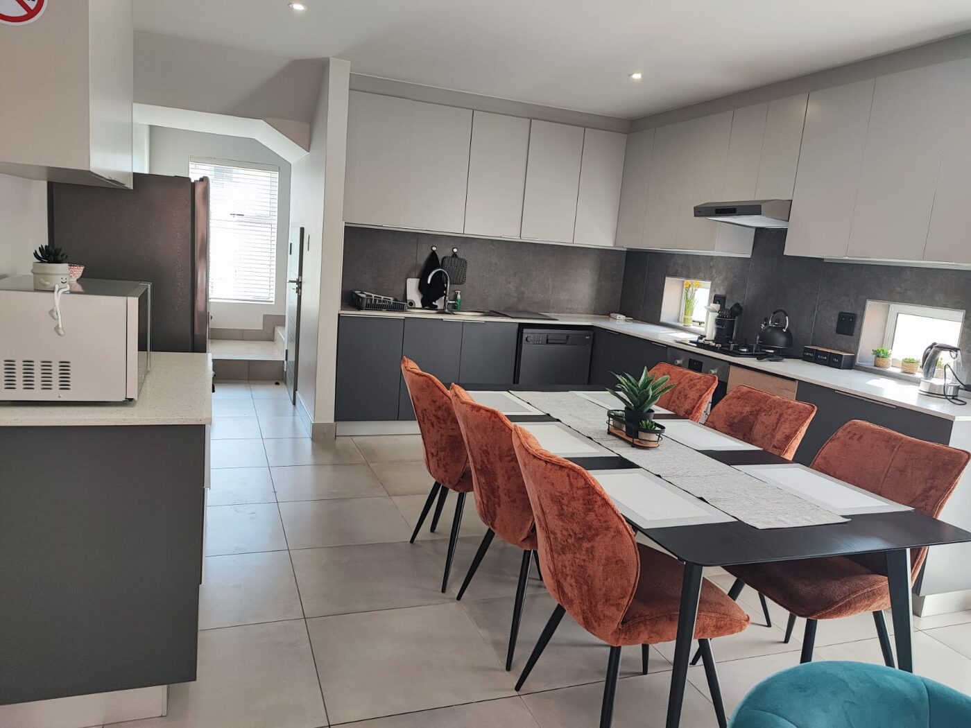 Open-plan kitchen and dining area cleaned and tidied by Cayroh Cleaning Solutions